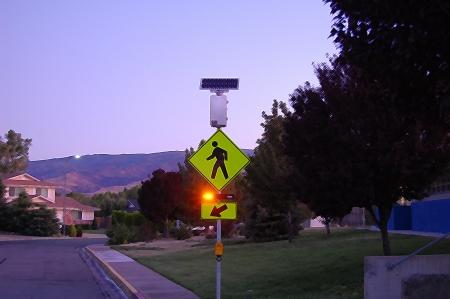 The rapid flashing beacons produce a daytime-visible light, warning drivers that they are approaching a condition on or adjacent to the roadway that might not be readily apparent and might require