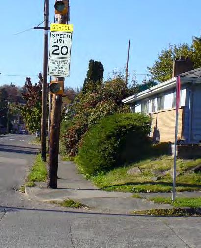 Walkable Zone Genesee between Rainier and 43 rd Along this arterial the sidewalk is narrow, there are poorly placed and constricting telephone poles, and there is often encroachment on the