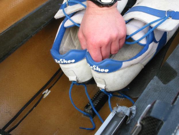 Fig 2: Checking the bow ball is secure. Always check the shoes and heel restraints. Never use a boat that has faulty heel restraints. Fig 3: Checking that the heal restraints are connected.