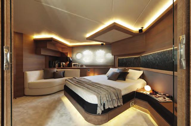 BELOW: While not full beam, the owner s suite with its bed at an angle and elegant ensuite deliver a suitable wow and the opening carbon-fiber T-Top, which is raked down ever so slightly at the front
