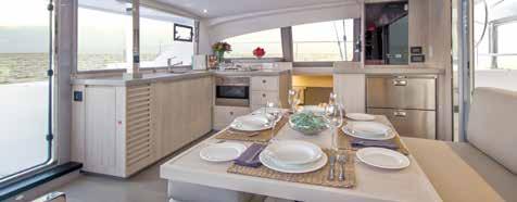 The modern galley boasts corian countertops, a stainless steel sink with single lever mixer