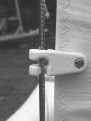 Ensure none of the rigging is tangled then attach the forward trapeze wires to the respective front beam shockcords 20.