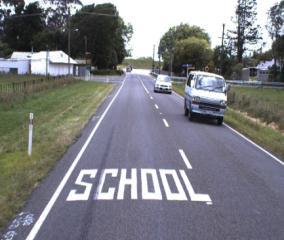 Road Markings School White text marked on the road on the approach to a school or entry to a school zone Informs drivers of school ahead Marked on approaches