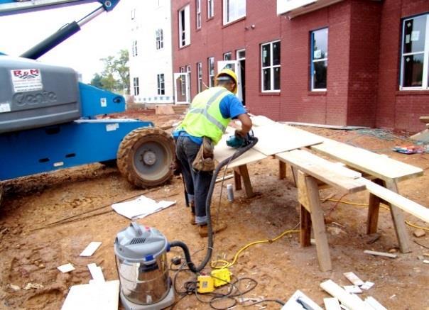 Jackhammering with water-spray control to reduce dust