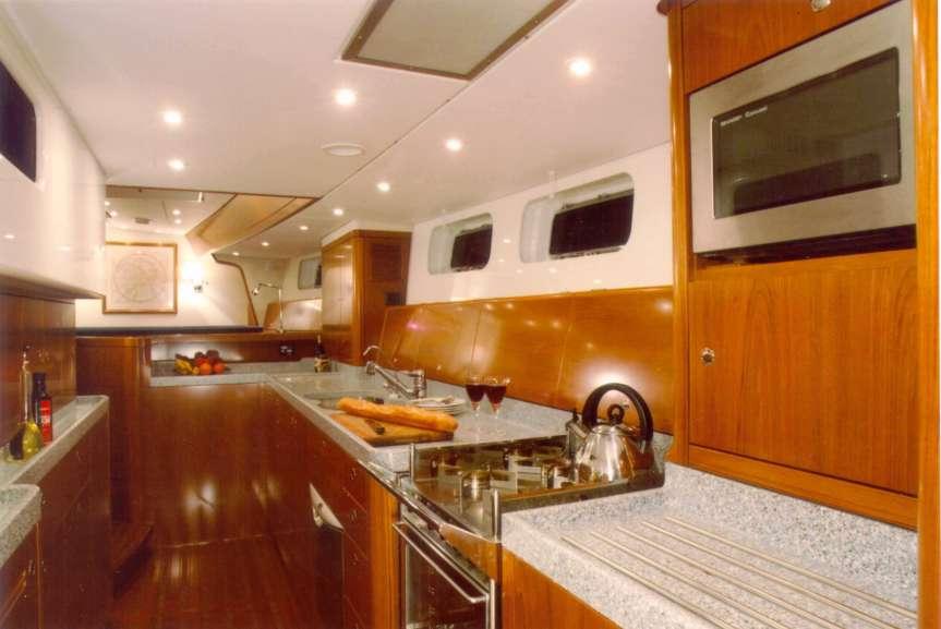 A BEAUTIFULLY CRAFTED GALLEY WITH HUGE AMOUNTS OF STOWAGE, REFRIGERATOR AND FREEZER CAPACITY.
