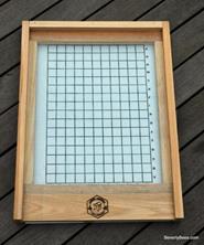 2. Insert the board sticky-side up below screen bottom boards or in the hive entrance with a screen cover on top to protect from bees for solid bottom boards 3.