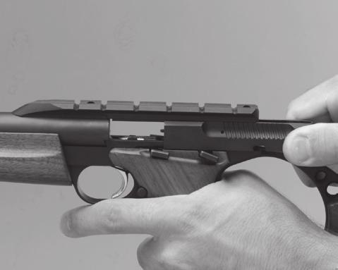 before inserting a loaded magazine. FIGURE 6 5 Place the safety up into the on safe position.