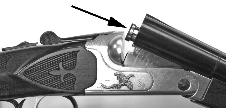 When the button is moved to the right (FIGURE 6) a R is revealed, which means that the right barrel has been selected to fire first. If the trigger is pulled again, the left barrel will then fire.