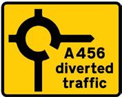 The diversion symbol may be varied to any of those shown on Working Drawing S56, to any combination of place names and route numbers, to a description of a route or to