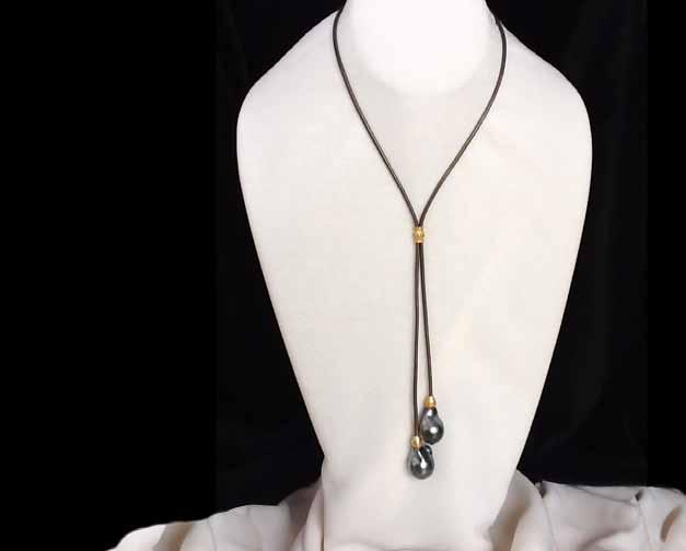 Big Pearls for the Big Sky girl! A Bolo styled lariat with 2 jumbo baroque teardrop Tahitian Pearls on leather.