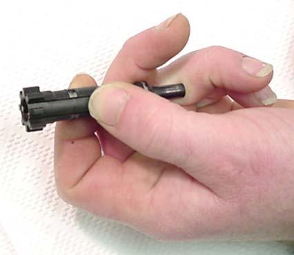 8. Remove the bolt assembly from the bolt carrier assembly.