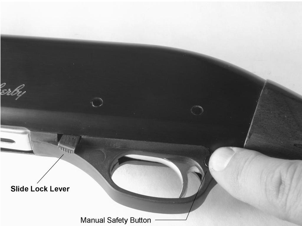 MANUAL SAFETY OPERATION The manual safety on the Weatherby Pump Shotgun PA-08 is a button-type safety located on the rear of the trigger guard.