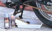 Before applying chain cleaner, put a tray under the chain and hold a towel behind the chain to prevent overspraying.