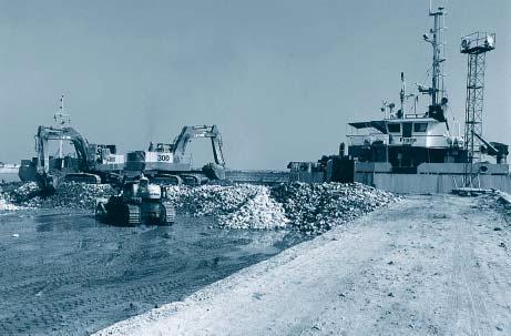 Figure 3. The side stone dumping vessel Frans being loaded at the temporary work harbour.