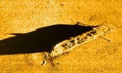 Target 2 (Figure 4) is a 50-meter long shipwreck broken in two pieces. It appears to be a wooden-hulled vessel with planking and frames clearly visible in the sonar images.