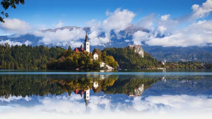 INTRODUCTION OF SLOVENIA SLOVENIA Location: Slovenia is in central Europe, bordering Austria in the north, Hungary in the northeast, Croatia in the south and south-east, and Italy and the Adriatic