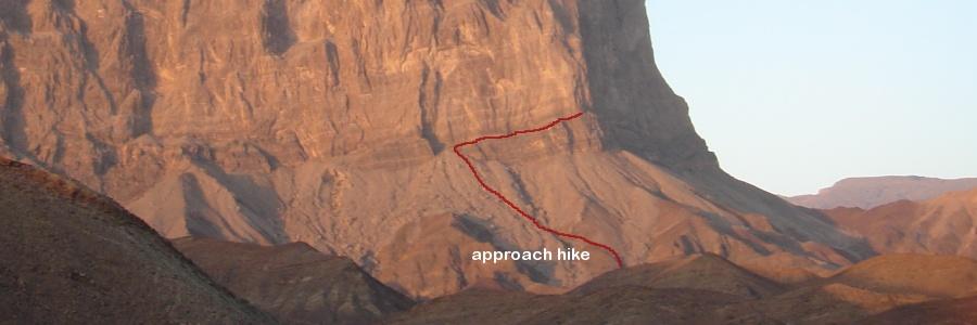 A rough track driveable in a standard high-clearance 4WD goes almost to the end of this wadi (2.3km from the black-top). Camp where the track ends.