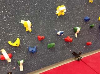 Target Practice Climbers toss bean bags into targets while climbing.