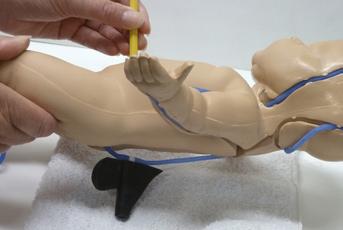Instructions for Replacing Veins on Nita Newborn TM 1. Remove head, two arm and right leg skins.