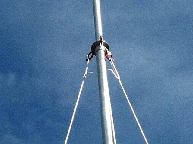 Photo 21. Guy stays are installed prior to raising the mast.