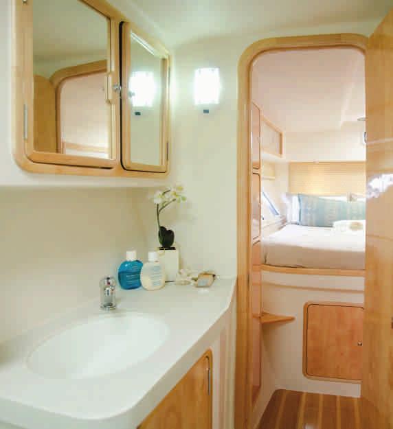 Beautiful ladies vanity with large mirror and power points for a hairdryer or other accessories. TV system above open-ended comfortable berth with ample reading light.