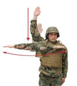 Close Up - Start signal with both arms extended horizontally, palm forward, and bring hands together in front of the body momentarily.