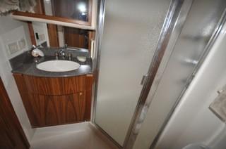 lockers Vanity w/mirrored cabinet & molded sink Private head