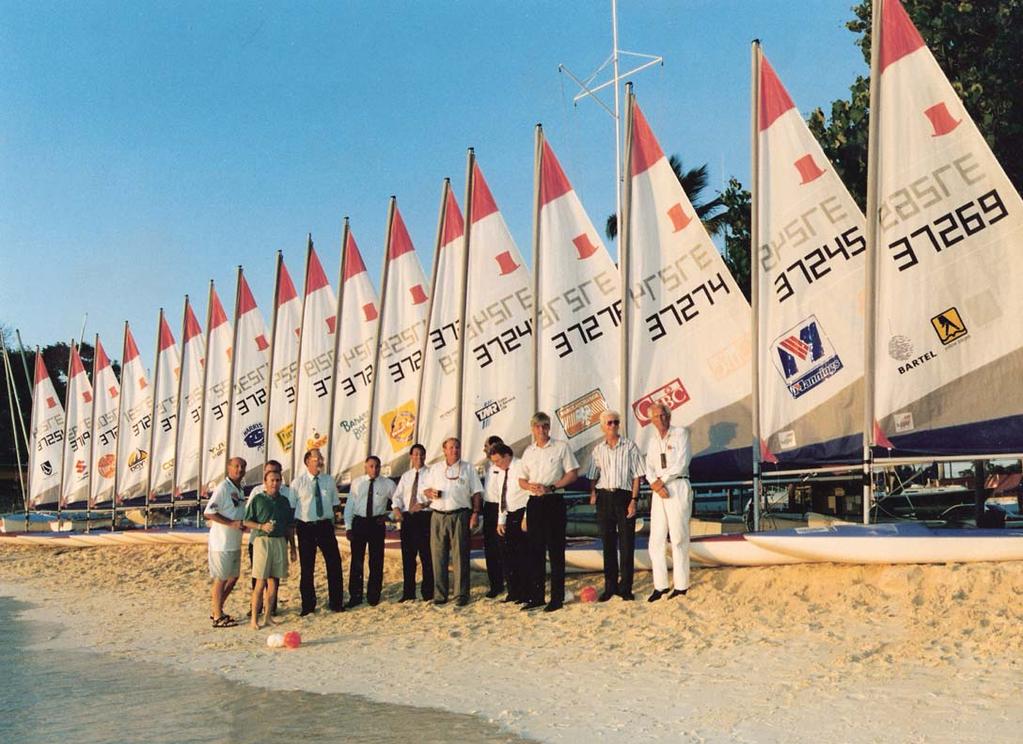 THE RHUMB LINE The fleet of brand new Topper dinghies with members of the Barbados Yachting Association (Photo Courtesy Barbados Sailing Association) Centre on Brighton Beach.