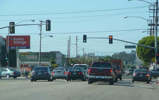 There is existing on-street parallel parking along the entire street. Western Avenue has two travel lanes in each direction, a center turn lane, and a posted speed limit of 35 mph.