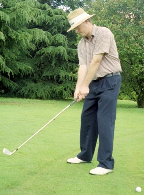 Once setup similar to picture 1 below, simply move the club back using your big muscles and stop when your hands are over your back foot (see picture 2 below). 1. 2. Setup in a normal type of setup.