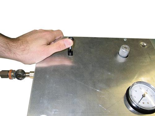 The black control lever has three positions as labeled on the control box. The knurled knob can be turned to restrict the airflow traveling into the dry suit.