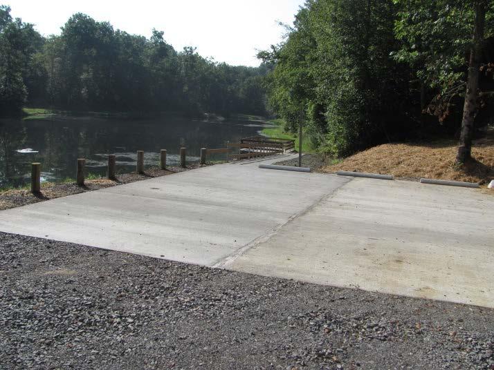 A gravel parking area and picnic tables are available.