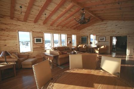 The gaming table and large screen television round out one of the most social areas of the cabin.