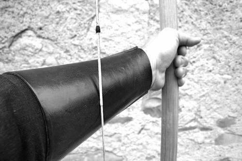 caused by friction and pressure of the bowstring.