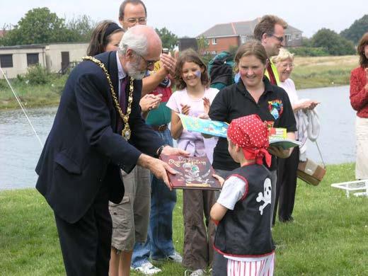 Figure 63 The Mayor presents a winner of the pirate fancy dress with a prize 4.