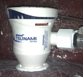 Install your rubber drain stop to keep the water in the tank.