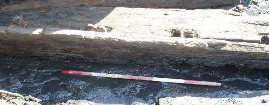 There is no evidence of how these timbers are fastened in either trench.