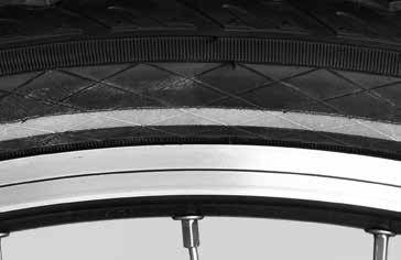 WHEELS AND TYRES Work both sides evenly around the circumference of the wheel. Towards the end you will need to press the tyre down firmly.