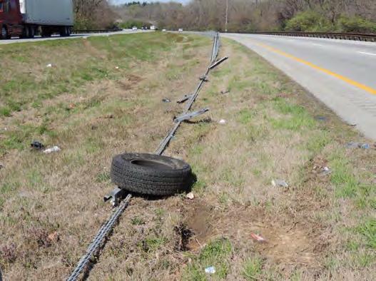 opposing lane. The vehicle rotated into the median. There was damage to four posts.