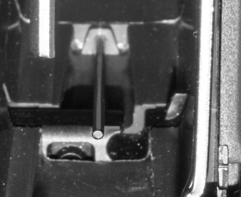 retainer notch The mechanism that retains the magazine catch is located inside the magazine well (FIG- URE 57).
