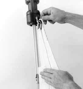 5) Pass luff tape through prefeeder and feeder into foil groove. 6) Attach head of sail or pendant at head of sail to halyard swivel. 7) Hoist sail.