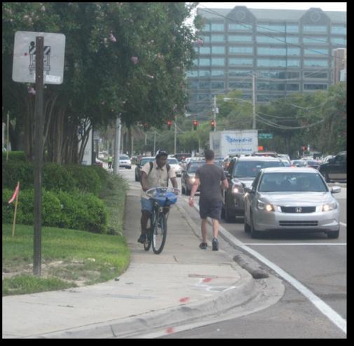 The existing ROW is purposed to maximize vehicle travel lanes, providing minimal pedestrian and transit facilities, and no dedicated bicycle facilities.