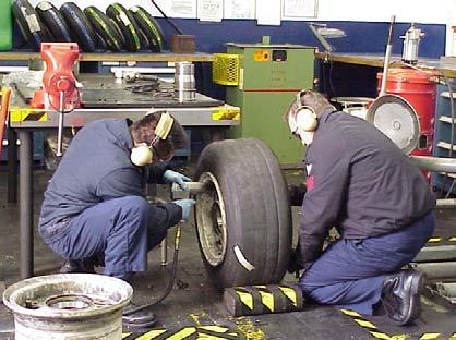 Ergonomic issue description: Forceful exertions and Heavy Lifting: Handling 315 lb. tires requires heavy lifting and high forces to maneuver the tires throughout the repair process.