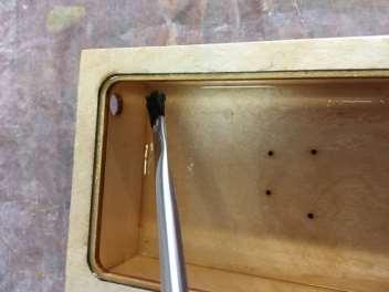 It will make it impossible for the lid to seal properly. To get inside the upper part, bend an acid brush about 120 degrees, this works very well.