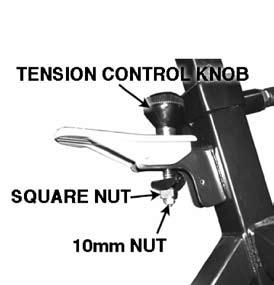 Use a wrench to remove the 10mm nut on the end of the tension control knob. 5.