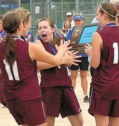 Staff photo by Steve Muscatello New Ulm Cathedral s Kari Berg (left), Kasey Bode (11), Leah Eckstein (middle) and Taylor Moldan (right) grab the Section 2A Championship trophy after defeating Lake