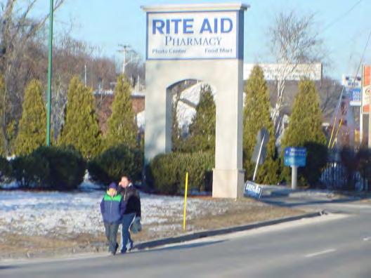 However, sight distance along the northwest corner of the intersection from the Rite-Aid driveway is restricted to less than approximately 100 feet by a sign, side vegetation, and fencing along the