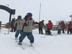 Walk on skis on snow Athlete can walk independently (forward, backward and in a circle) on skis on flat terrain.