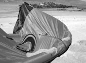 setup TIPS FOR SECURING YOUR KITE Never leave an inflated kite unattended on the beach for a long period of time. Winds may shift or change and the kite may become unsecured and fly off.