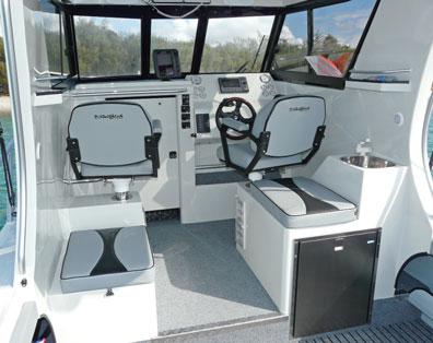 a lockable cabin door, and built in tackle storage drawers. The hard top also has provision for mounting radios overhead, flush fitted into the hardtop bulkhead.